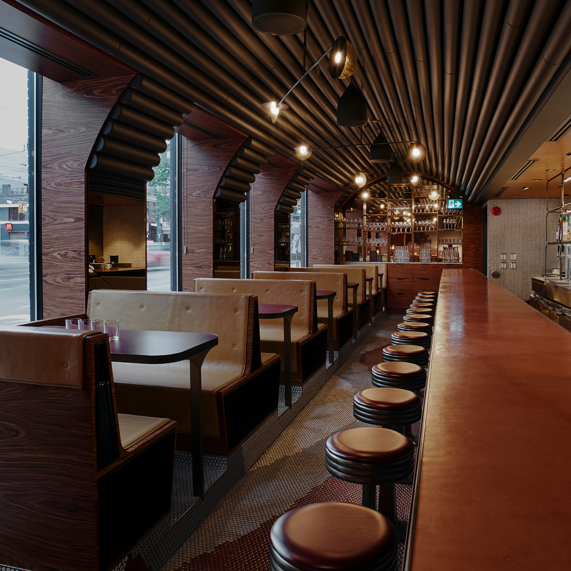 Aloette Spadina dining car: booths, bar stools, vaulted slat ceiling