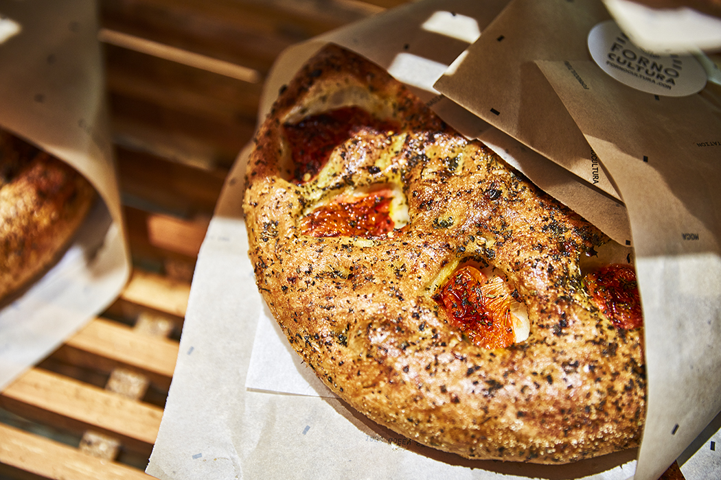 Tomato focaccia in Forno Cultura paper, official bakery photo