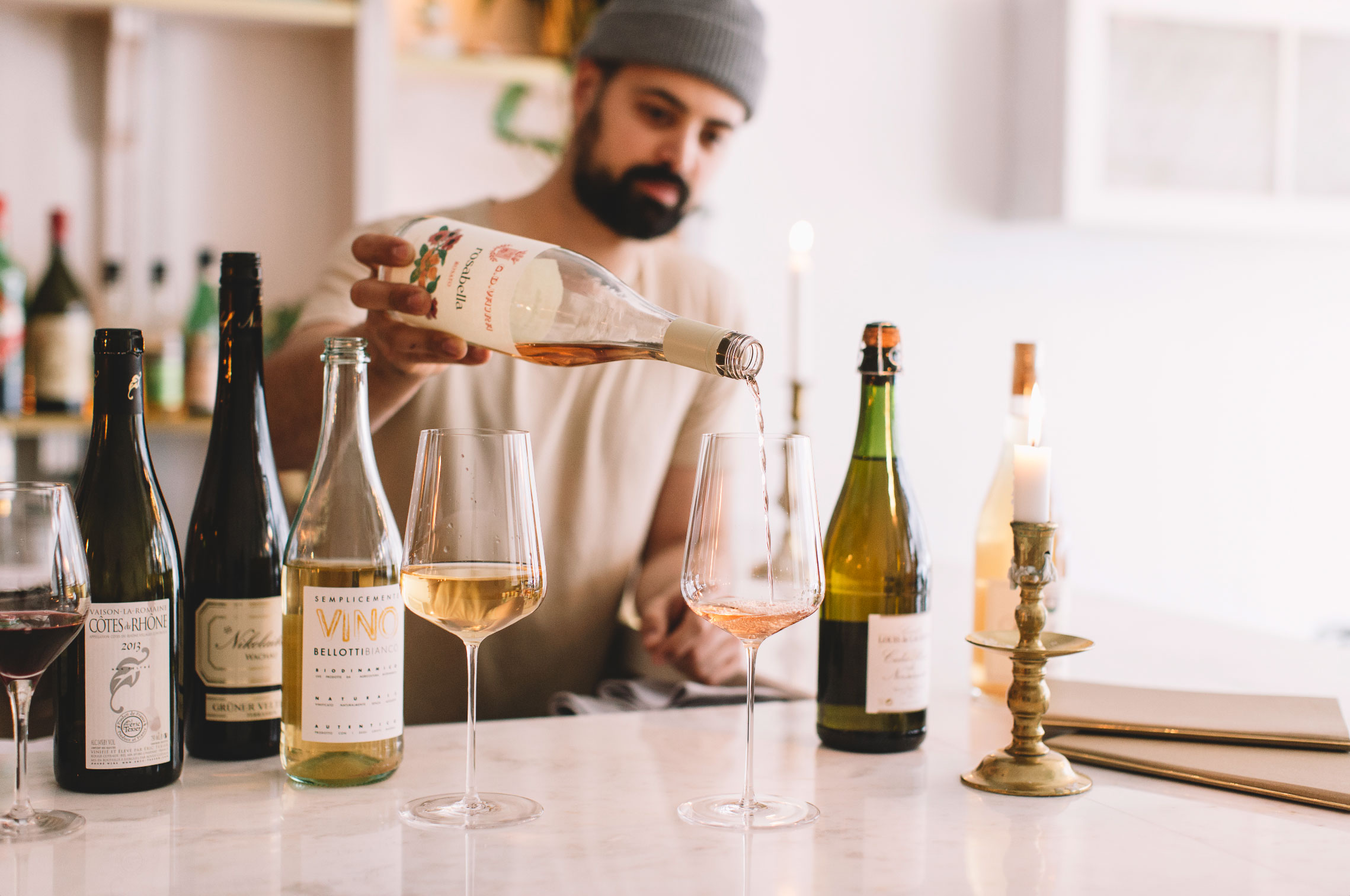 Wine being poured at the Grey Gardens bar