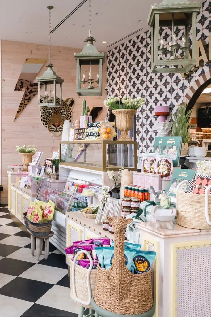 Interior of Mandy's Distillery shop: cookbooks, scalloped counter, checkered floor