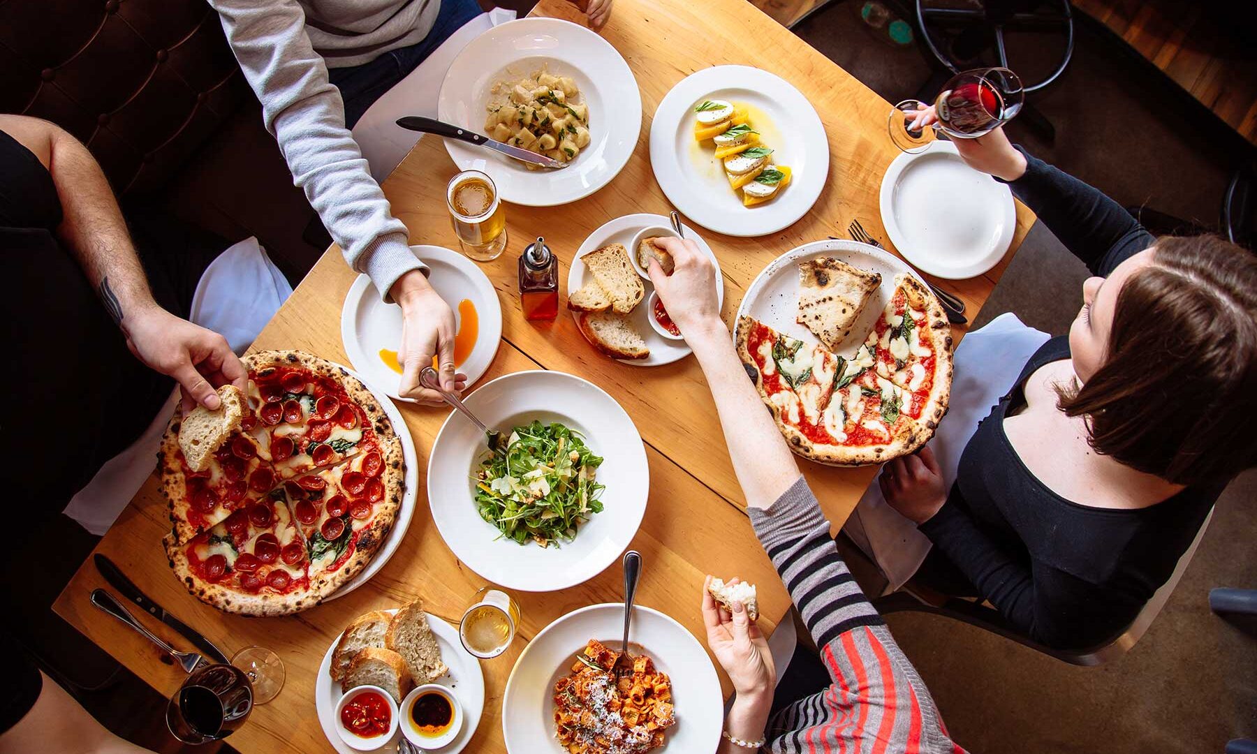 Wood-fired Neapolitan pizzas and pasta on a Libretto table